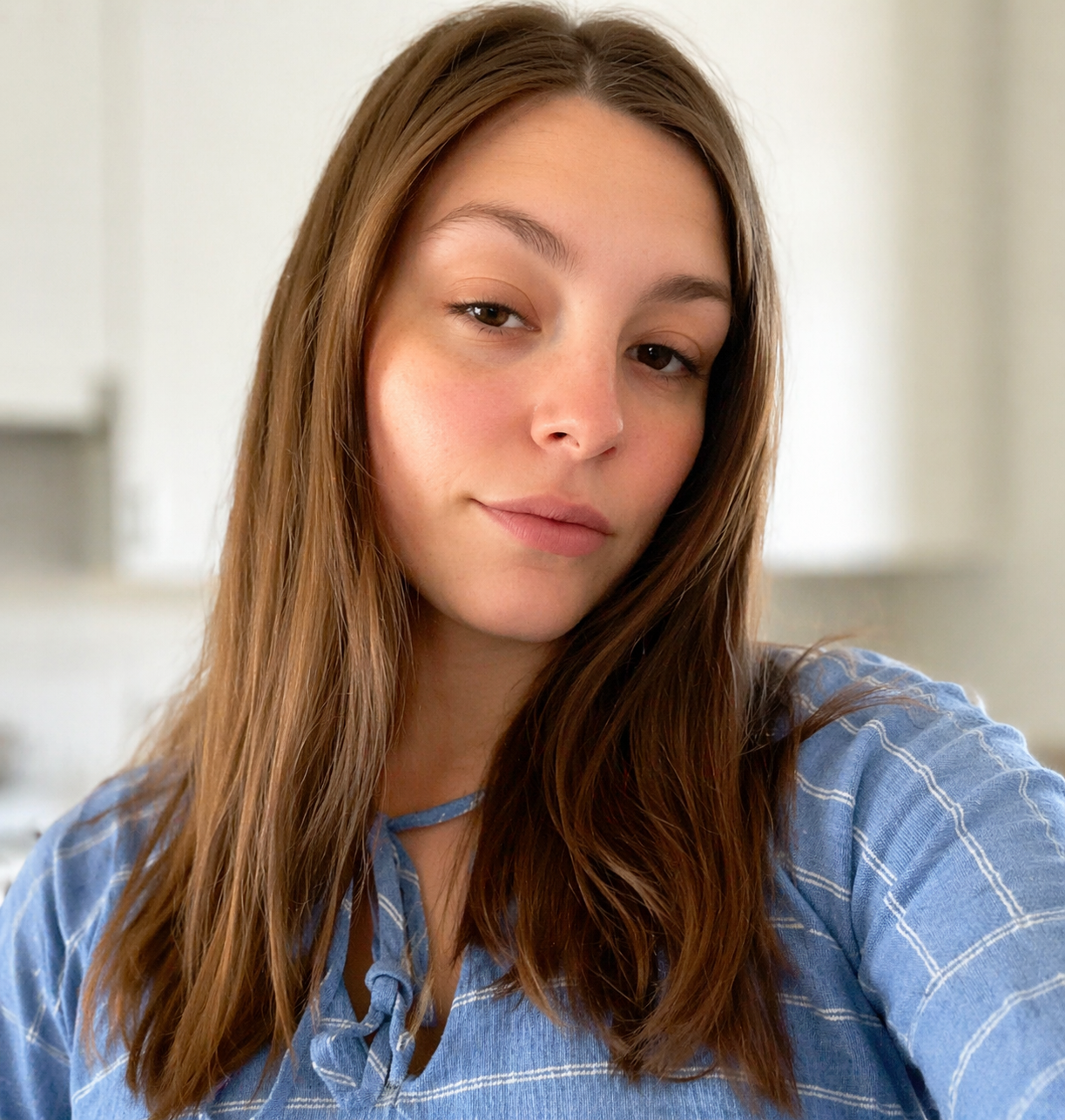 Young woman smiling after getting life insurance coverage quickly online with TrustedLifeRates