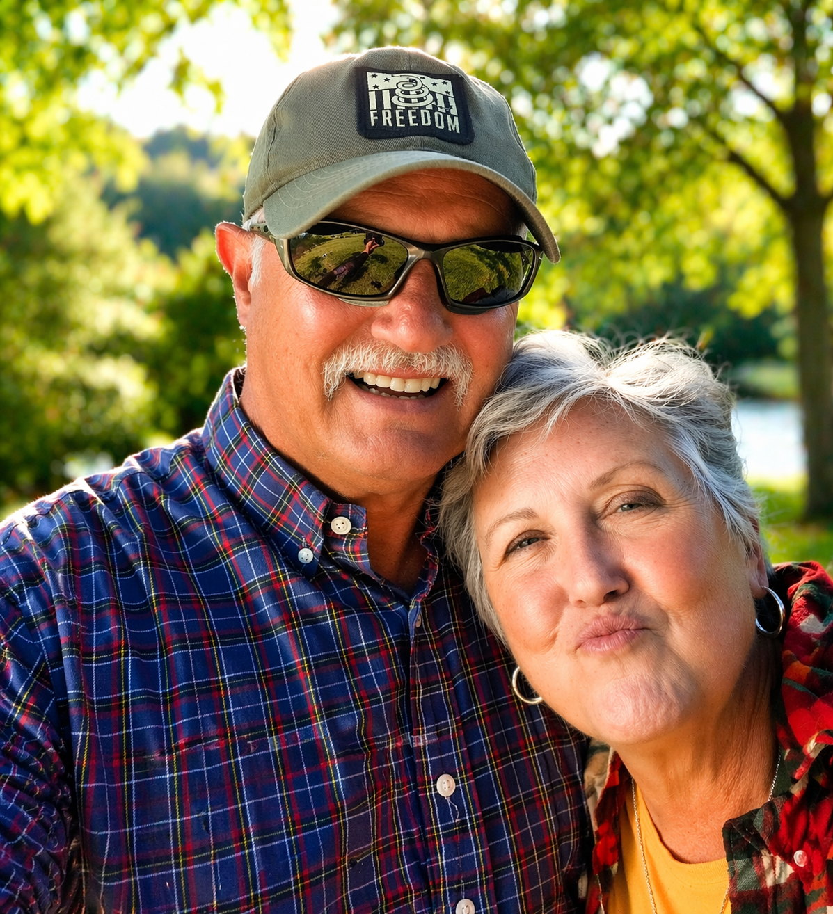 Senior couple smiling outdoors after getting life insurance coverage for family protection with TrustedLifeRates